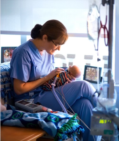 Dr. Laura Price and one of her young patients.